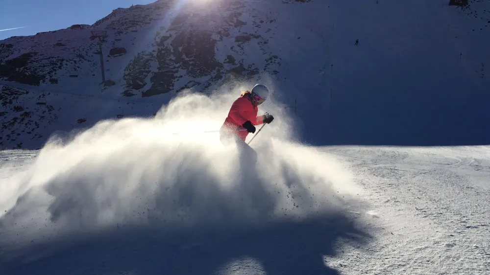 skier creating snow cloud